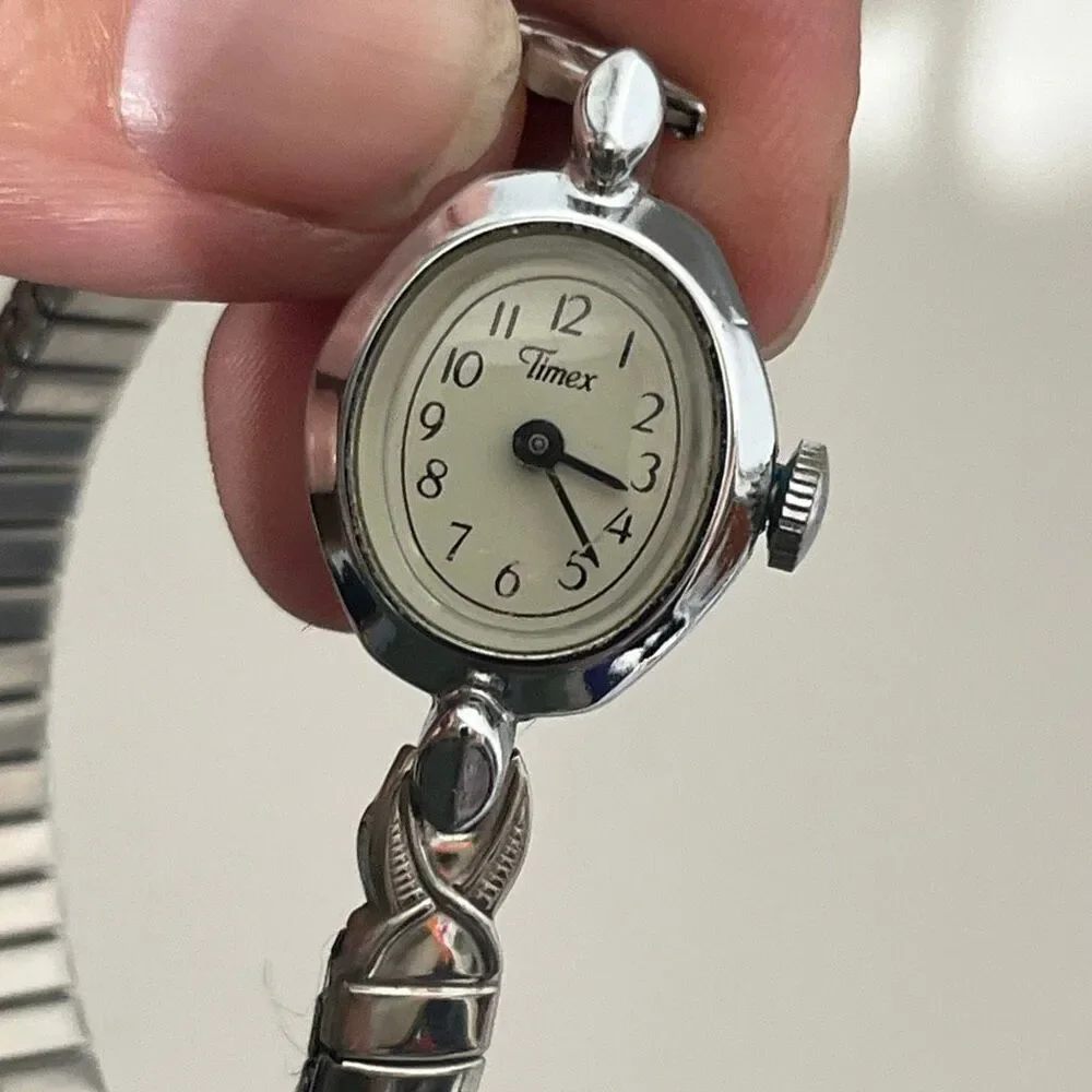 Vintage Timex Women's Silver Tone Manual Wind Oval‎ Stainless Stretch Band Watch